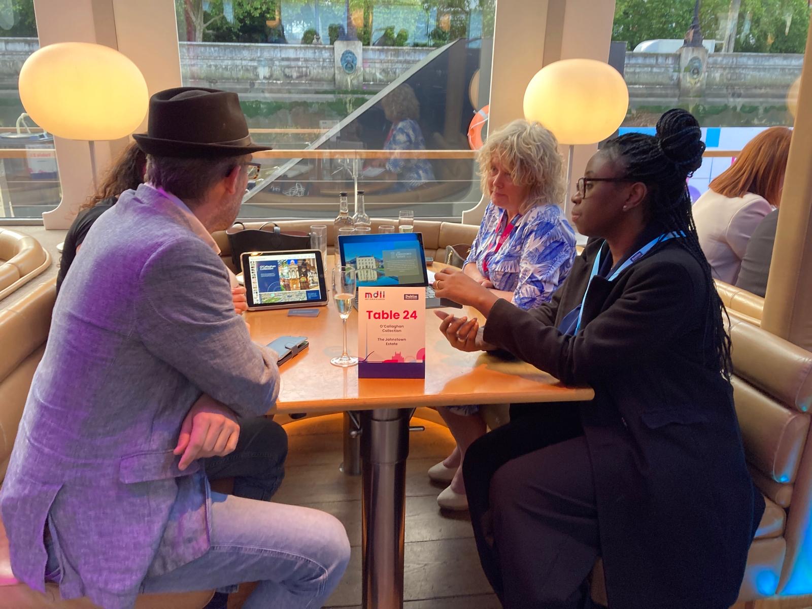Snapshot of four people meeting at a diner during the Meet Dublin event in London
