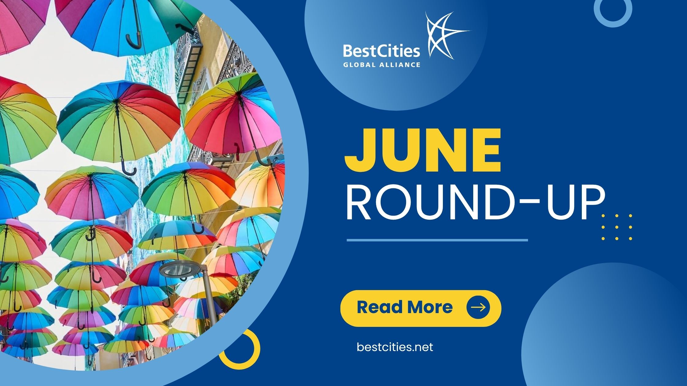 Colorful umbrellas hang above a street on the left, with "June Round-Up" and BestCities Global Alliance branding on the right.
